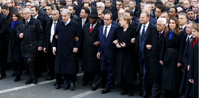 French President Francois Hollande is surrounded by head of states as they attend the solidarity march (Marche Republicaine) in the streets of Paris January 11, 2015. French citizens will be joined by dozens of foreign leaders, among them Arab and Muslim representatives, in a march on Sunday in an unprecedented tribute to this week's victims following the shootings by gunmen at the offices of the satirical weekly newspaper Charlie Hebdo, the killing of a police woman in Montrouge, and the hostage taking at a kosher supermarket at the Porte de Vincennes.       REUTERS/Yves Herman (FRANCE  - Tags: CRIME LAW POLITICS CIVIL UNREST SOCIETY TPX IMAGES OF THE DAY)   - RTR4KWYX